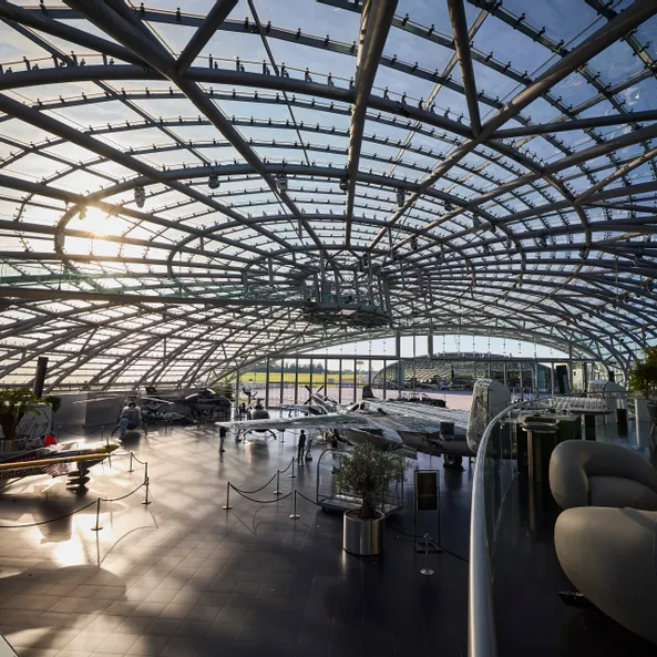 Interior view of Hangar-7 showing its glass-and-steel architecture and exhibits in the exhibition