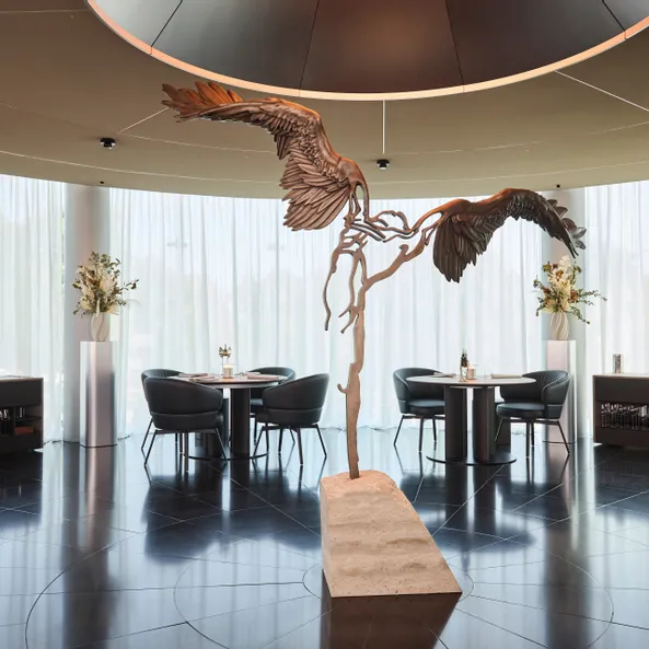 inside area of Restaurant Ikarus with Ikarus sculpture