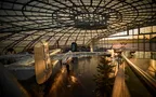 Interior view of Hangar-7 showing its glass-and-steel architecture and exhibits in the exhibition