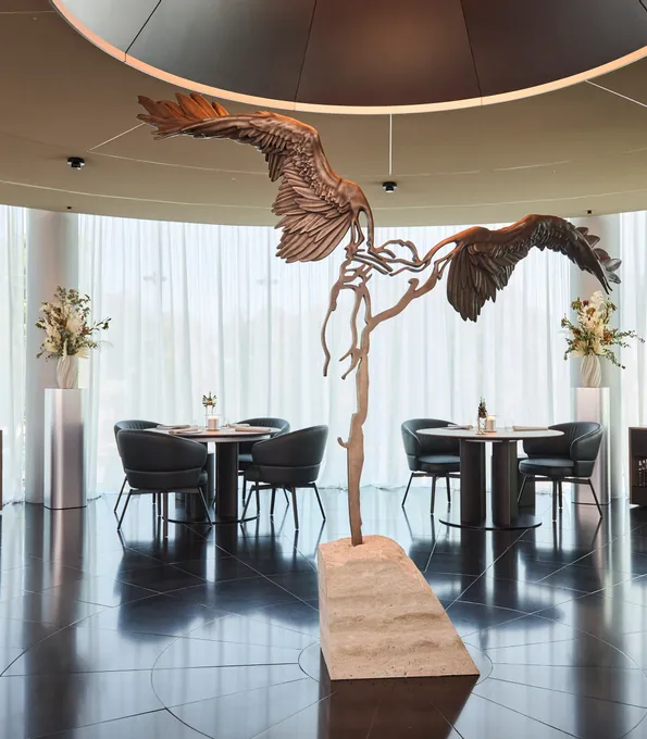 inside area of Restaurant Ikarus with Ikarus sculpture