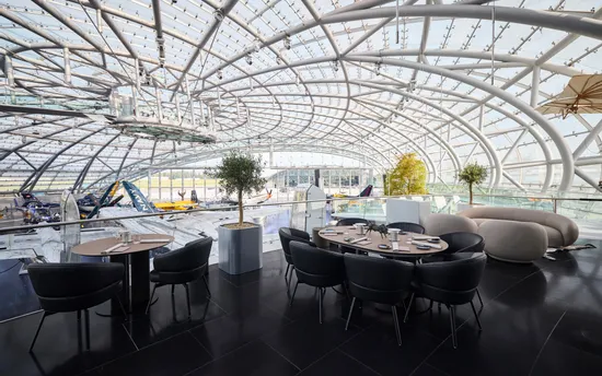 Set table at Restaurant Ikarus terrace with view of the exhibition 