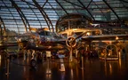 Interior view of Hangar-7 showing its glass-and-steel architecture and an aircraft in the exhibition