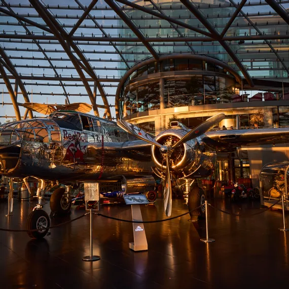 Interior view of Hangar-7 showing its glass-and-steel architecture and an aircraft in the exhibition